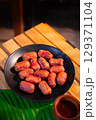 The Fried red sausage on Black Plate for Thai food concept. 129371104