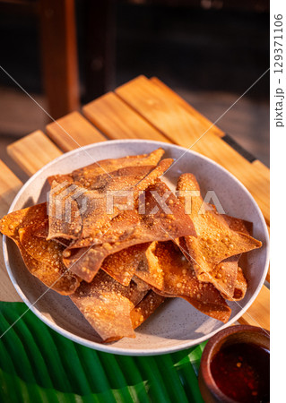 The Fried dumplings on white bowl for food concept. The Fried dumplings on white bowl for food concept. 129371106