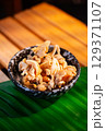 The Fried pork rinds in bowl for food concept. 129371107