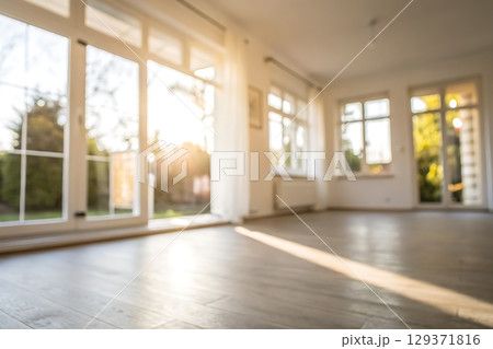 Bright and Airy Empty Room with Large Windows and Sunlight Streaming In Bright and Airy Empty Room with Large Windows and Sunlight Streaming In 129371816