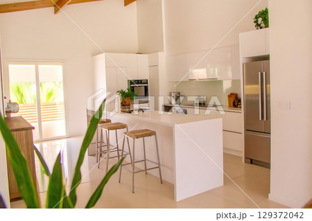 Modern Minimalist Kitchen with Bright Interiors and Open Space Design Concept 129372042