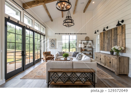 Cozy Modern Living Room with Rustic Decor and Abundant Natural Light in a Serene Setting 129372049