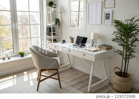 Bright and Modern Home Office with Stylish Desk, Chair, Plants, and Natural Light Bright and Modern Home Office with Stylish Desk, Chair, Plants, and Natural Light 129372086