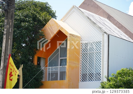 Detailed view of windows, doors and balconies of city buildings  129373385