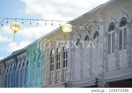 Detailed view of windows, doors and balconies of city buildings  129373386