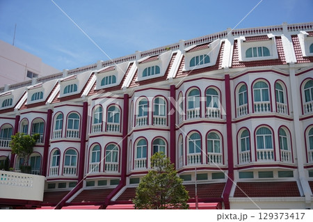 Detailed view of windows, doors and balconies of city buildings  129373417