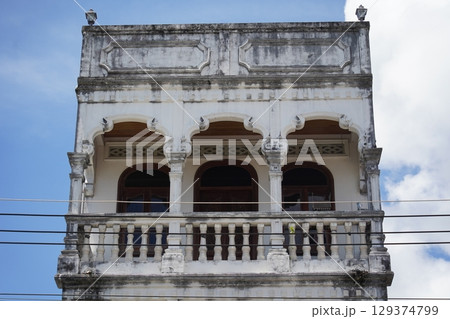 Detailed view of windows, doors and balconies of city buildings Detailed view of windows, doors and balconies of city buildings 129374799