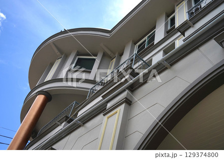 Detailed view of windows, doors and balconies of city buildings  129374800