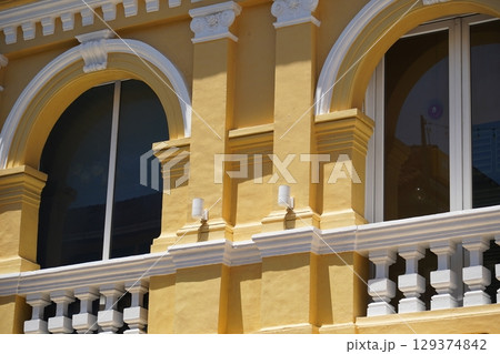 Detailed view of windows, doors and balconies of city buildings  129374842