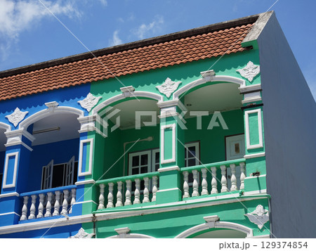 Detailed view of windows, doors and balconies of city buildings  129374854