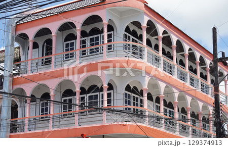 Detailed view of windows, doors and balconies of city buildings  129374913