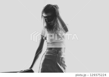 Sexy nude young woman with black mask posing near the sofa Sexy nude young woman with black mask posing near the sofa 129375224