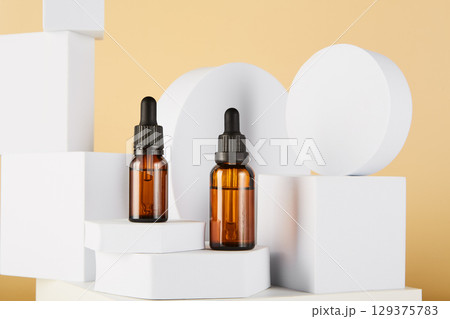 Dropper vials mock-ups, cosmetic glass containers. Dropper vials mock-ups, cosmetic glass containers. 129375783