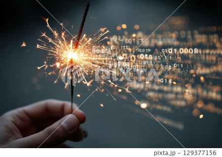 Hand Holding Glowing Sparkler with Bright Sparks and Background of Binary Numbers Hand Holding Glowing Sparkler with Bright Sparks and Background of Binary Numbers 129377156