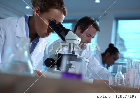 Scientists Conduct Research in Sterile Biotech Laboratory Focusing on Microscopy and Experiments 129377198