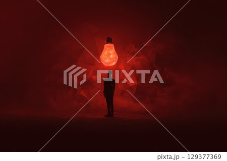 A man stands in front of a red wall with a glowing light bulb on his head 129377369