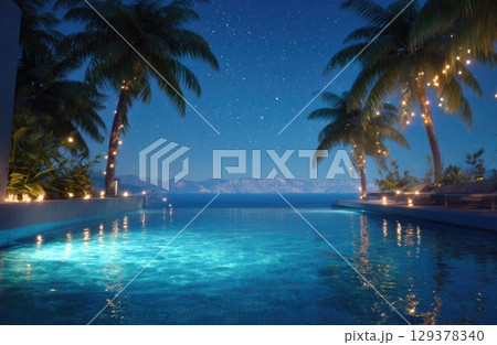 an infinity pool overlooking the ocean at night, with palm trees and lights 129378340