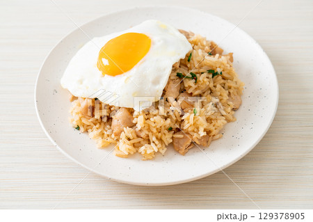 fried rice with pork and fried egg in Japanese style 129378905