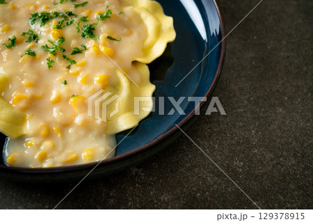 ravioli pasta with corn cheese sauce 129378915