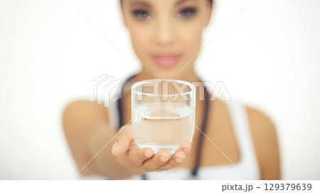 A female nurse of hispanic descent offers a 129379639