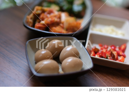 century eggs Chinese century eggs or tea egg in boiling water close-up. Chinese culinary dish made by preserving duck, chicken, or quail eggs in a mixture of clay, ash, salt, quicklime, and rice hulls century eggs Chinese century eggs or tea egg in boiling water close-up. Chinese culinary dish made by preserving duck, chicken, or quail eggs in a mixture of clay, ash, salt, quicklime, and rice hulls 129381021