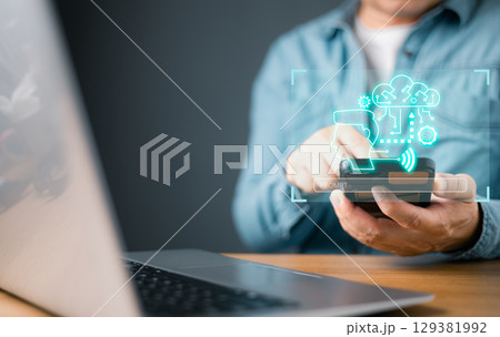 man engages with a glowing virtual interface showcasing AI, chatbot, and neural network icons, representing artificial intelligence, advanced communication, smart technology solutions in a futuristic. 129381992