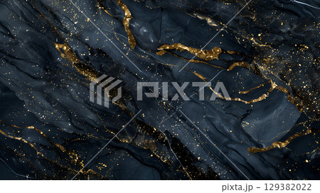 Elegant black marble texture with golden veins creating a luxurious background Elegant black marble texture with golden veins creating a luxurious background 129382022