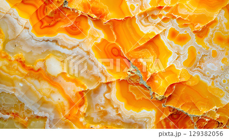 Bright orange marble texture showcasing intricate patterns and natural formations 129382056