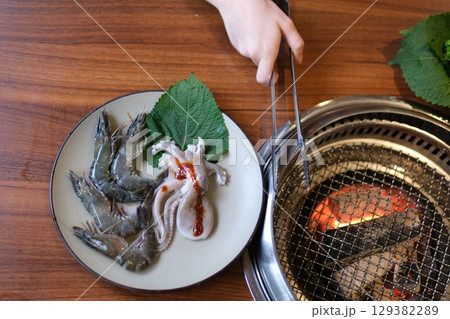 octopus squid cooking grill grills octopus seafood octopus mussels shrimp on hot bbq thai asian style, slow motion octopus squid cooking grill grills octopus seafood octopus mussels shrimp on hot bbq thai asian style, slow motion 129382289