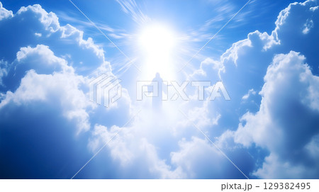 Jesus ascending to heaven surrounded by bright clouds in the sky 129382495