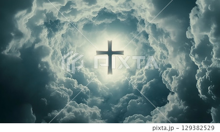 A cross illuminated by heavenly light amidst dramatic clouds symbolizes resurrection and hope 129382529
