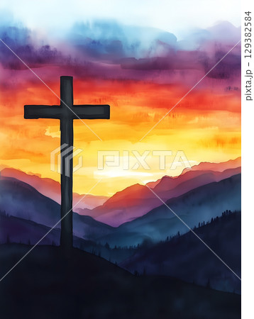 The silhouette of a crucifix against a vibrant sunset in the mountains The silhouette of a crucifix against a vibrant sunset in the mountains 129382584