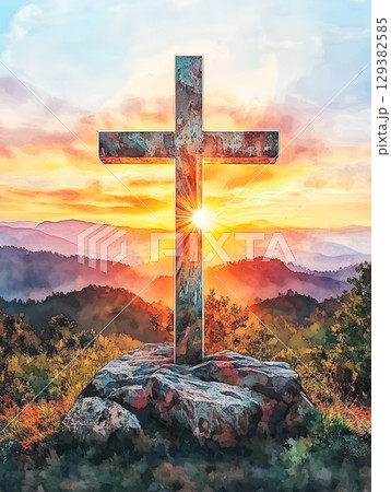 The crucifix symbol of Jesus against a vibrant sunset over the mountain landscape The crucifix symbol of Jesus against a vibrant sunset over the mountain landscape 129382585