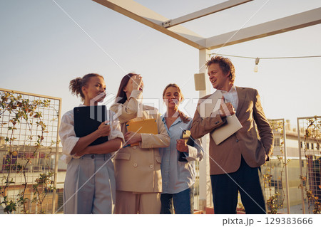A Business Team Collaboration Focused on Effective Rooftop Meeting Dynamics and Strategies A Business Team Collaboration Focused on Effective Rooftop Meeting Dynamics and Strategies 129383666