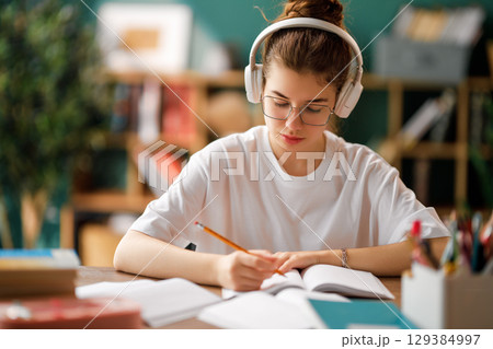 Child is learning in the class 129384997
