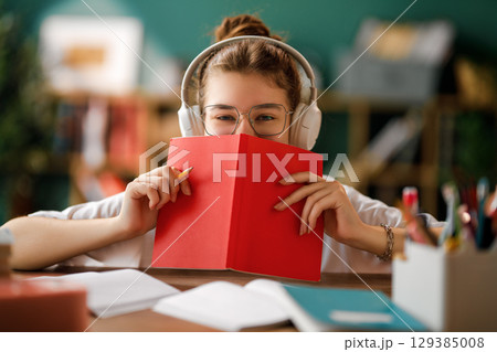 Child is learning in the class Child is learning in the class 129385008