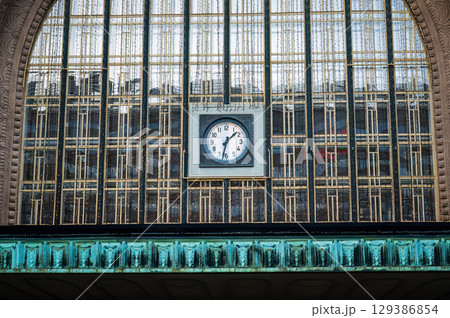 Clock on facade of Helsinki Central Railway Station building 129386854
