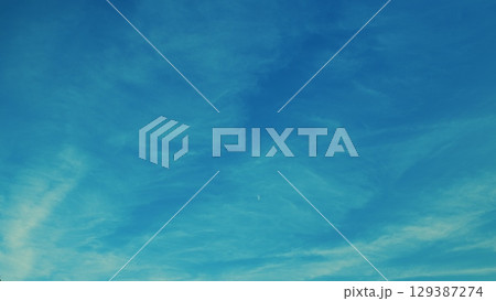 A Beautiful Blue Sky adorned with Wispy Clouds, creating a stunning visual masterpiece A Beautiful Blue Sky adorned with Wispy Clouds, creating a stunning visual masterpiece 129387274