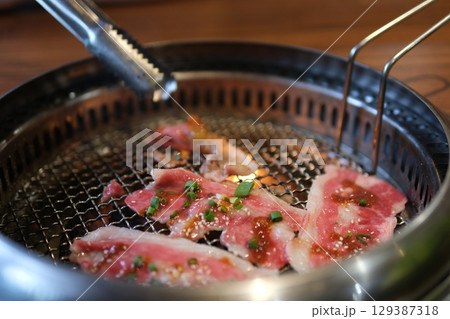 Japanese cuisine:"YAKINIKU" grilled meat on a grill 129387318
