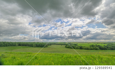 A Serene and Picturesque Landscape Set Against Dramatic and Captivating Skies Above 129389541