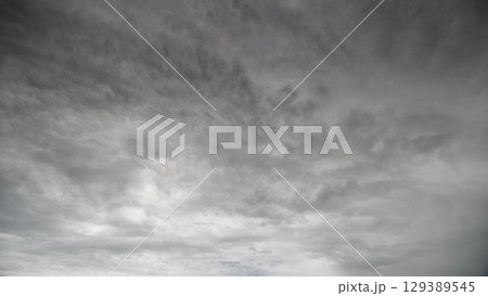 A Dramatic Overcast Sky Filled with Layers of Beautiful and Varied Clouds Above Us 129389545
