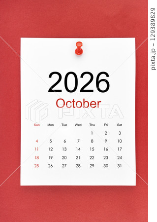 October 2026 calendar page with push pin on red color background. October 2026 calendar page with push pin on red color background. 129389829