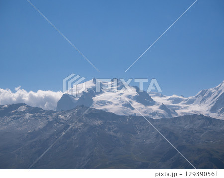 Mettelhorn, Switzerland - August 24th 2024: Impressive view from the summit towards Dufourspitze Mettelhorn, Switzerland - August 24th 2024: Impressive view from the summit towards Dufourspitze 129390561