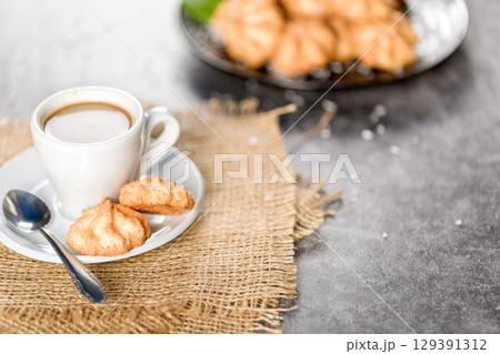 Homemade coconut cookies on a gray background. Healthy food concept. For advertising confectionery products Homemade coconut cookies on a gray background. Healthy food concept. For advertising confectionery products 129391312