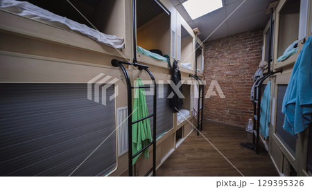 Capsule hotel offering comfortable and affordable sleeping pods 129395326