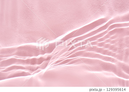 Abstract pink water background with streaks of water. 129395614