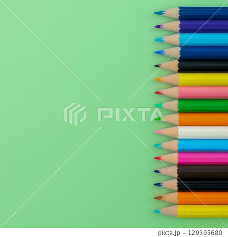 Color pencils on green background. Concept of creativity, drawing, education, and back to school. Color pencils on green background. Concept of creativity, drawing, education, and back to school. 129395680