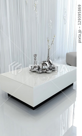 A white coffee table with a silver vase and two other vases on it 129395869