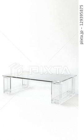 A clear glass table with a white background 129395875
