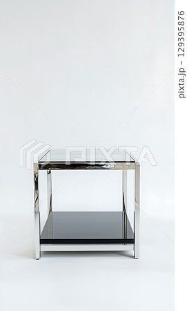 A black and silver table with a glass top 129395876